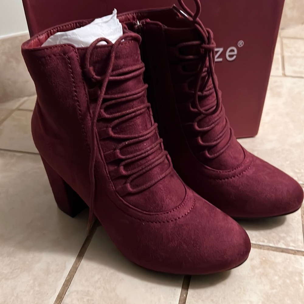 NWOT plum suede look bootie .